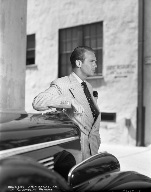 Douglas Fairbanks Jr beside a car Photo Print - Item # VARCEL688956