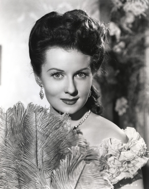 Rhonda Fleming holding a feather fan Photo Print - Item # VARCEL689169