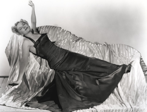 Joan Fontaine Lying on a Couch wearing Black Gown Photo Print - Item # VARCEL689333
