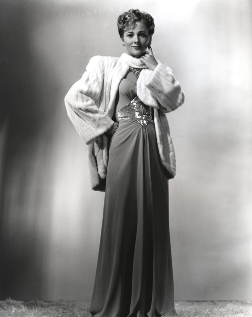 Joan Fontaine wearing a Gown and a Fluffy Coat Photo Print - Item # VARCEL689332