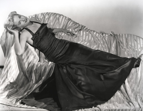 Joan Fontaine Lying on the Couch wearing Black Gown Photo Print - Item # VARCEL689337