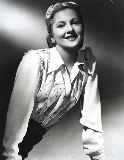 Joan Fontaine Leaning with Her Two Hand, wearing a White Dress and Black Skirt Photo Print - Item # VARCEL689348