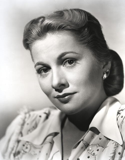 Joan Fontaine wearing a White Shirtdress with Matching Earrings in a Close Up Portrait Photo Print - Item # VARCEL689380