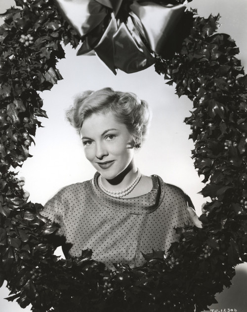 Joan Fontaine wearing a Pearl Necklace and Holding a Christmas Wreath Photo Print - Item # VARCEL689371