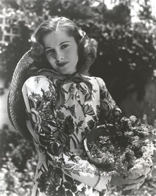 Joan Fontaine holding flowers outdoors Photo Print - Item # VARCEL689386