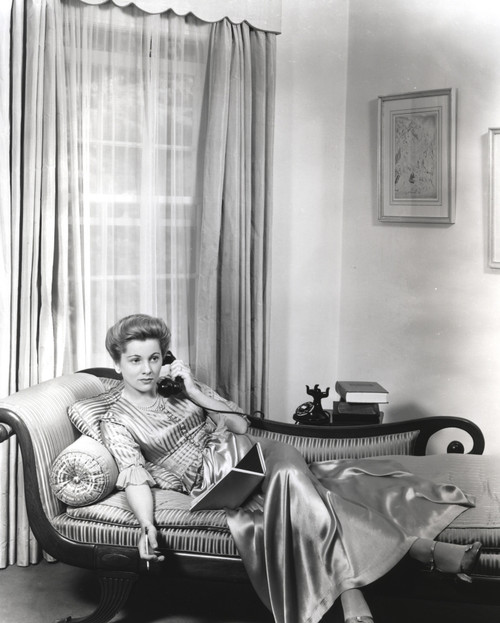 Joan Fontaine Answering a Telephone Photo Print - Item # VARCEL689393