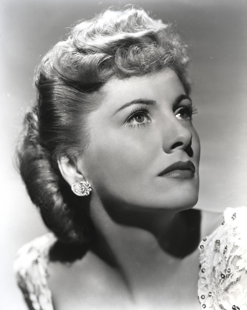Joan Fontaine Looking Up and wearing an Earrings in a Portrait Photo Print - Item # VARCEL689402