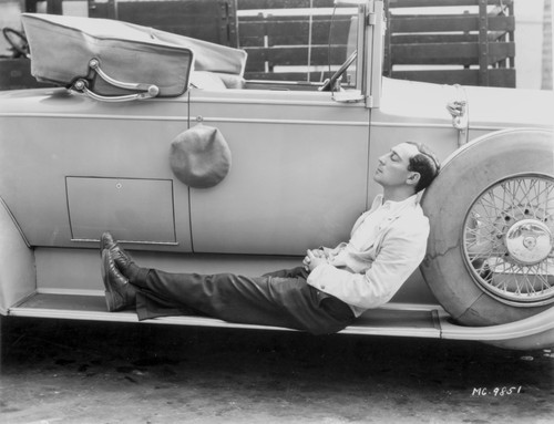 Buster Keaton sleeping on a car Photo Print - Item # VARCEL689572