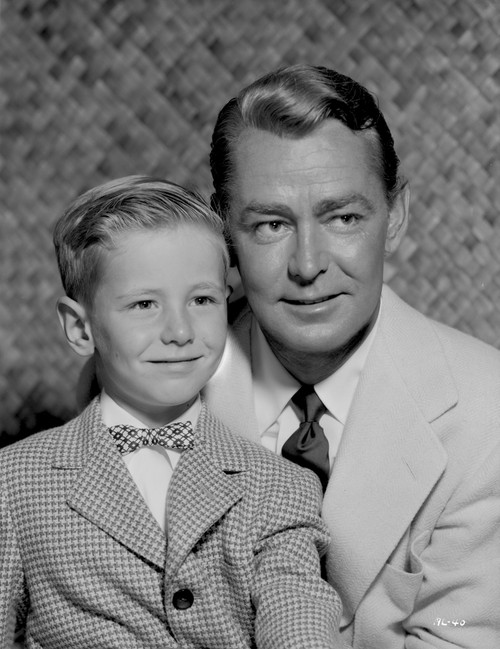 Alan Ladd smiling with a Child Photo Print - Item # VARCEL689777