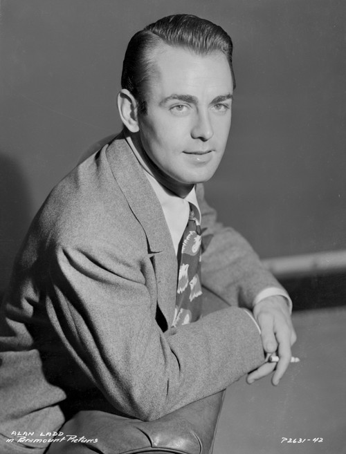 Alan Ladd Leaning on the Chair and Smoking a Cigarette in Black and White Portrait Photo Print - Item # VARCEL689792