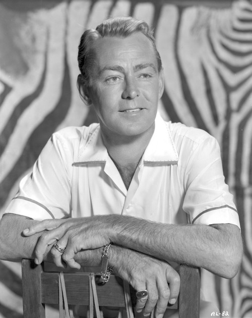 Alan Ladd smiling and posed on the Chair in Black and White Portrait Photo Print - Item # VARCEL689822