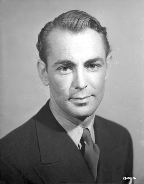 Alan Ladd smiling and wearing a Suit in Close Up Portrait Photo Print - Item # VARCEL689825