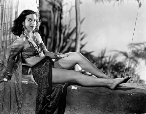 Hedy Lamarr wearing a costume sitting outdoors Photo Print - Item # VARCEL689867