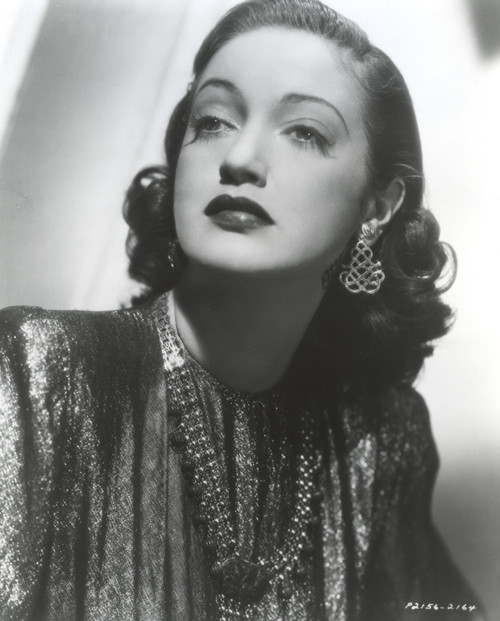 Dorothy Lamour wearing a metallic dress and earrings Photo Print - Item # VARCEL689917