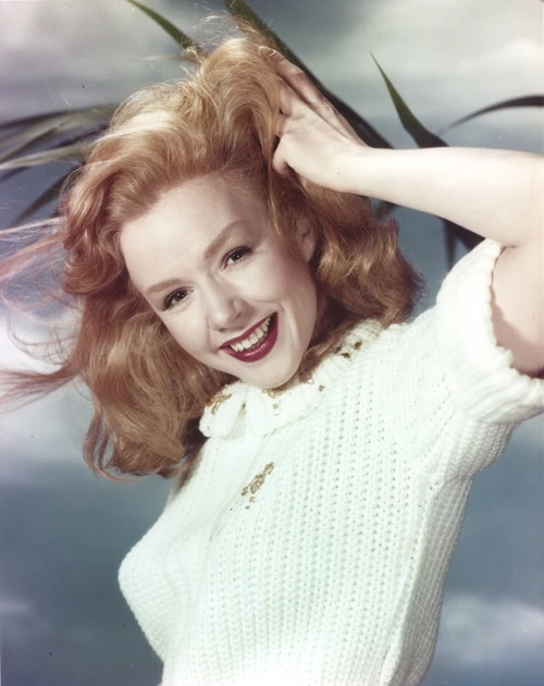 Piper Laurie Posed in a Portrait while Holding Hair in White Sweater Photo Print - Item # VARCEL690073
