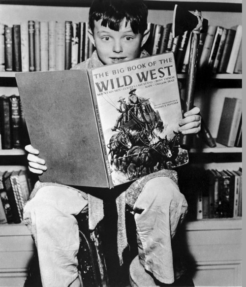A film still from Leave It To Beaver with a boy reading a book Photo Print - Item # VARCEL690127
