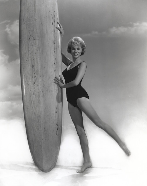Janet Leigh Posed in Black Linen Swimsuit with Hands Holding a Large and Long Surf Board Photo Print - Item # VARCEL690174