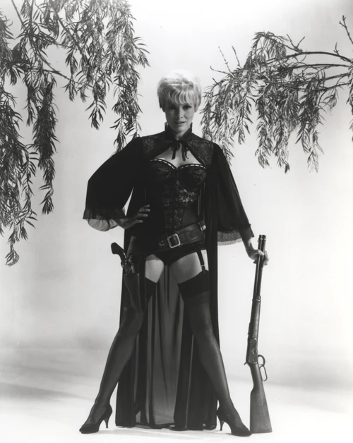 Janet Leigh wearing a corset and holding a rifle Photo Print - Item # VARCEL690182