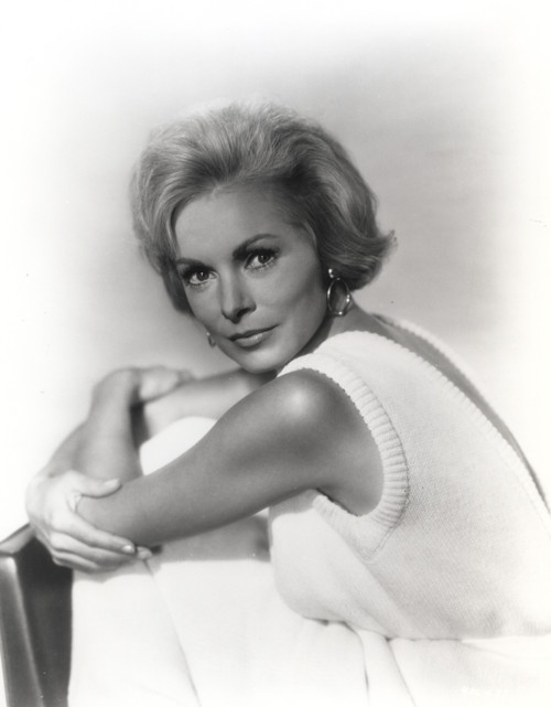 Janet Leigh Posed in White Sleeveless Cotton Dress and Hoop Earrings with Arms Crossed and Knees Bent Photo Print - Item # VARCEL690205