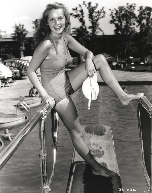 Janet Leigh Posed in Grey One Piece Swimsuit with Left Foot on the Steel Pool Handle Photo Print