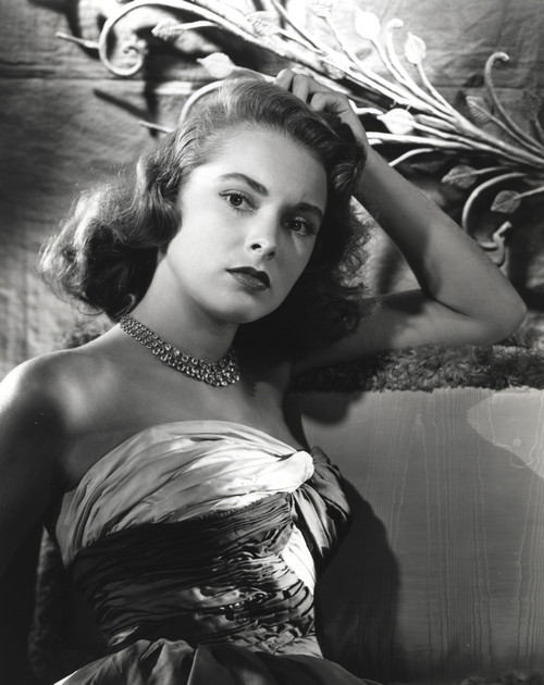Janet Leigh sitting on the Couch in Strapless Gatherer Bodice Shoulder Dress with Right Hand on the Head Photo Print - Item # VARCEL690220