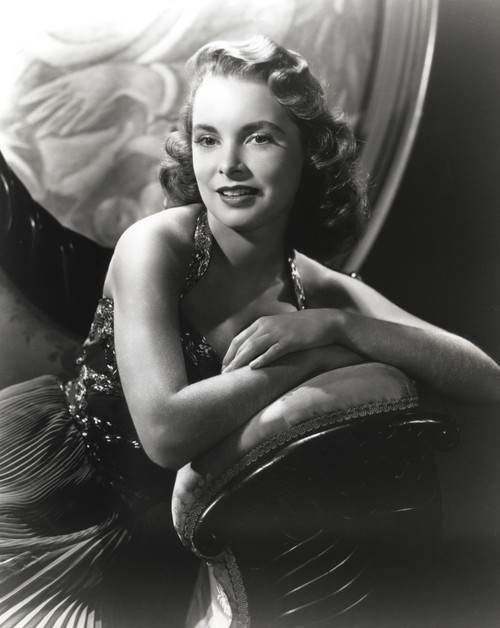 Janet Leigh sitting on the Couch in Black Velvet Strap Dress with Arms Rest on the Chair Arm Photo Print - Item # VARCEL690234