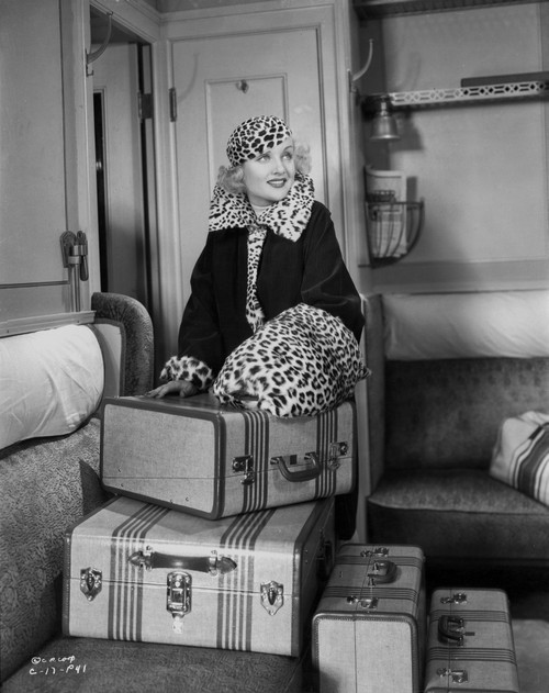 Gina Lollobrigida Opening Suitcase in Black Coat Photo Print - Item # VARCEL690385
