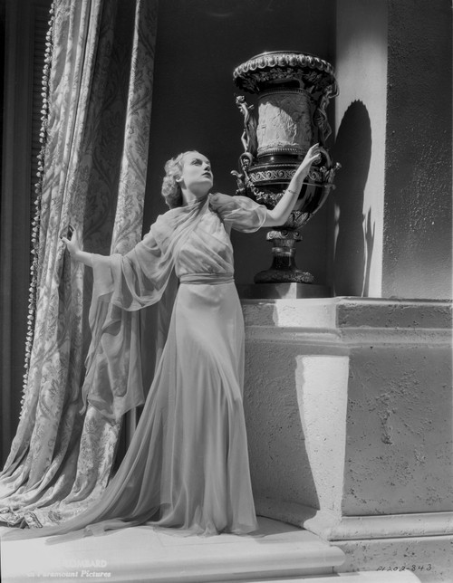 Carole Lombard wearing a Long Gown and Looking Up Photo Print - Item # VARCEL690402