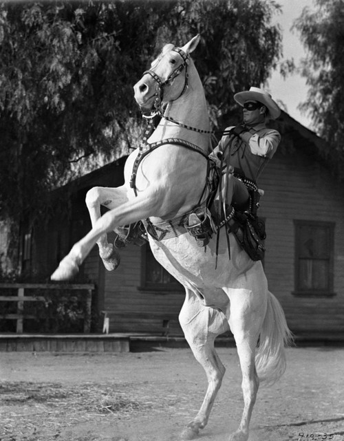 Lone Ranger Riding a Horse, wearing a Cowboy Attire Photo Print - Item # VARCEL690414