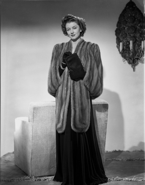 Myrna Loy standing in Robe with Gloves Photo Print - Item # VARCEL690527