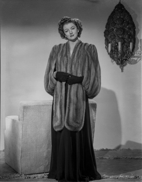 Myrna Loy standing in Furry Gown Classic Photo Print - Item # VARCEL690554