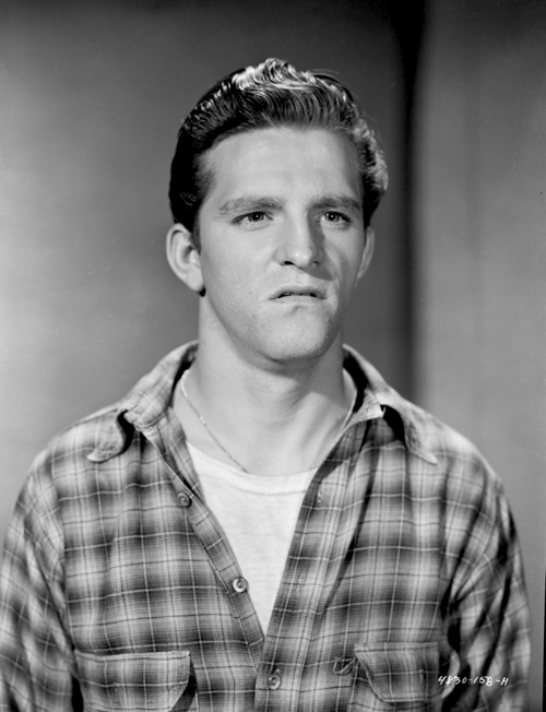 A Stanley Clements wearing a plaid shirt Photo Print - Item # VARCEL691127