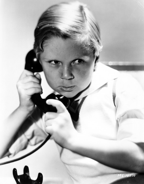 A Jackie Cooper talking on the telephone Photo Print - Item # VARCEL691239