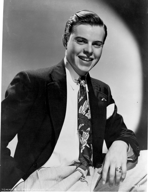 Tommy Dix smiling in Black Coat Photo Print - Item # VARCEL691436