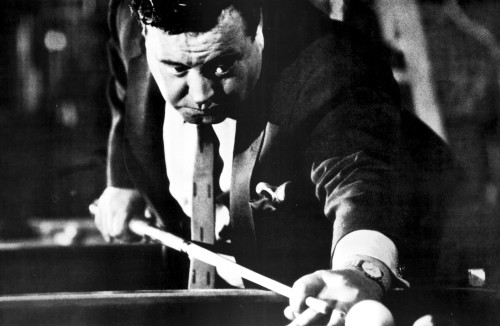 A film still of Jackie Gleason shooting pool Photo Print - Item # VARCEL691805