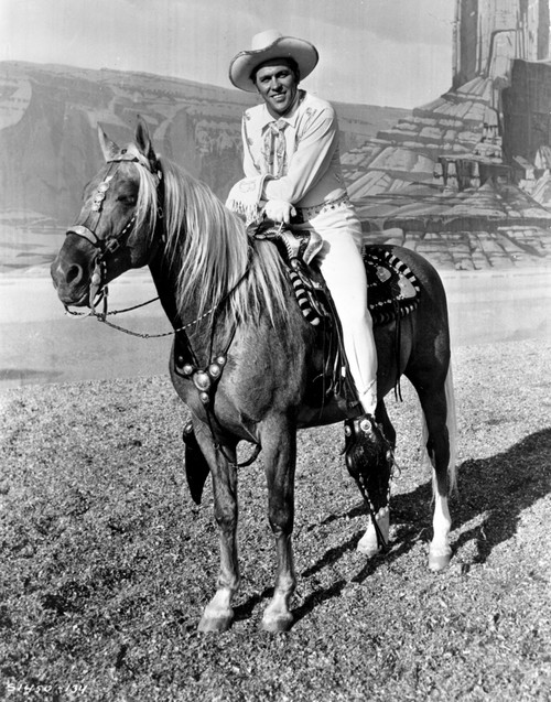 Howard Keel Riding Horse in White Outfit Photo Print - Item # VARCEL692238
