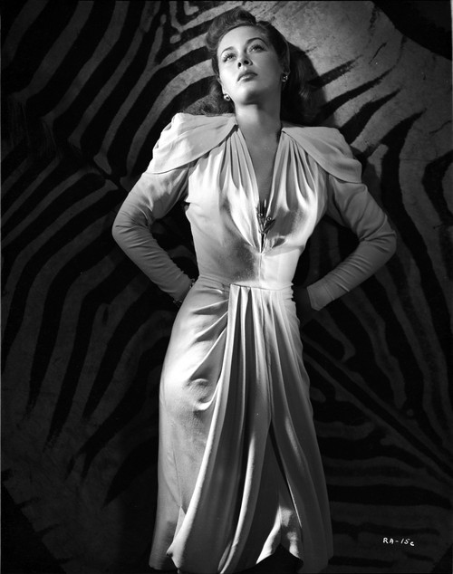 Ramsey Ames Looking Up in White Formal Dress in Black and White Portrait Photo Print - Item # VARCEL692811