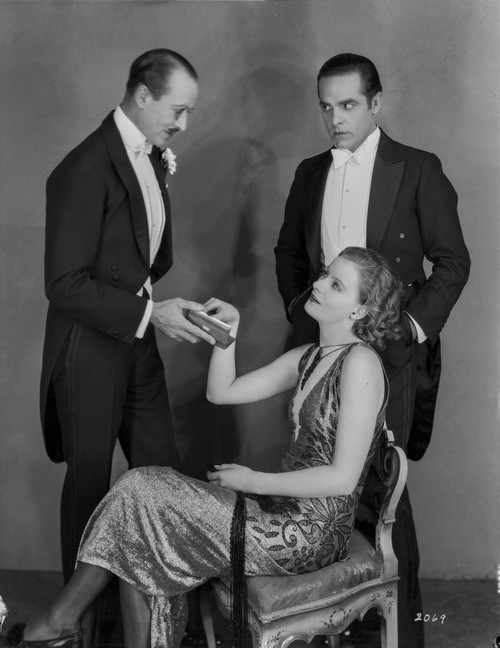 Greta Garbo Siting on Chair Admired by Two Gentleman Photo Print - Item # VARCEL692876