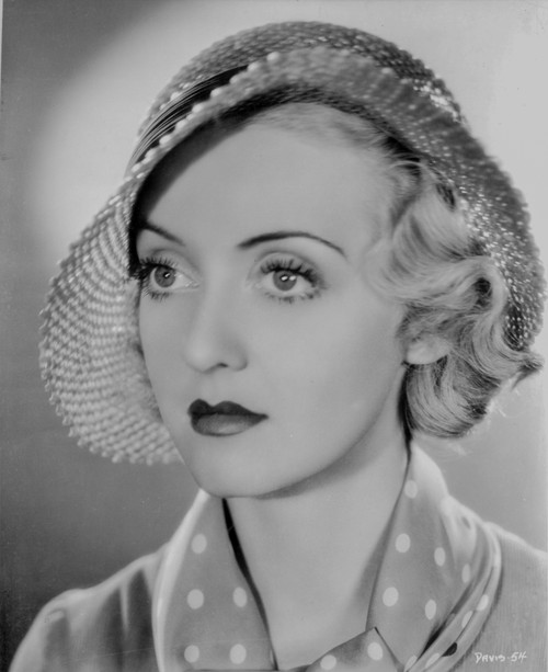 Bette Davis Portrait in Round Straw Hat and White Polka Dot Necktie and Silk Dress Photo Print - Item # VARCEL692975