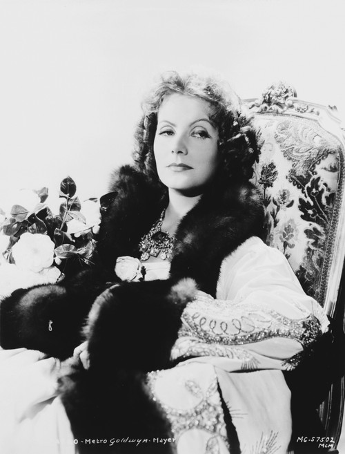 Greta Garbo Posed Siting on Chair in Classic Outfit Photo Print - Item # VARCEL693055