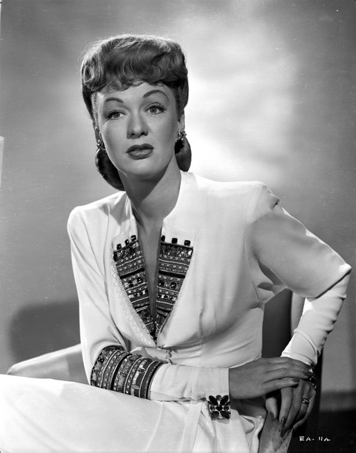 Eve Arden on Long Sleeve Dress sitting on Chair Portrait Photo Print - Item # VARCEL693081