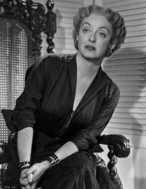 Bette Davis Seated on Chair with Hands Together in Black V-Neck Folded Long Sleeve Dress and Bracelet with Marcel Wave Hair Photo Print - Item # VARCEL693114