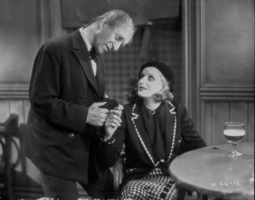 Greta Garbo with a Man Giving Present Photo Print - Item # VARCEL693124