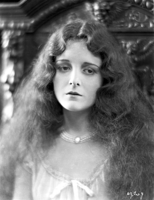 Mary Astro Portrait wearing Necklace and Curly Long Hair Photo Print - Item # VARCEL693229