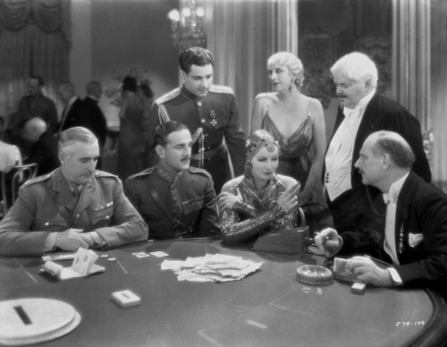 Greta Garbo Talking to a Men from a Movie Scene Photo Print - Item # VARCEL693255