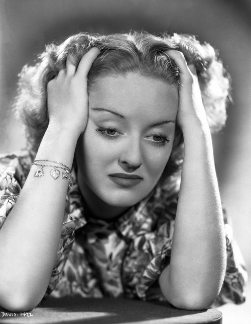 Bette Davis Portrait Hands on the Forehead Looking Down the Table in Floral Silk Shirt Photo Print - Item # VARCEL693257