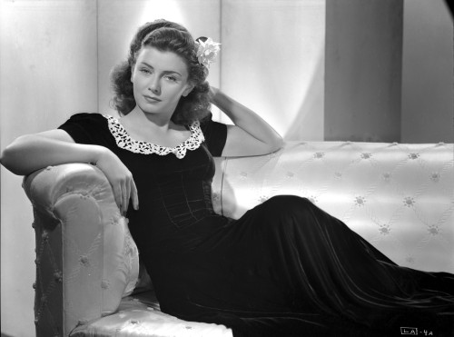 Lenore Aubert on a Dress sitting on a Couch Photo Print - Item # VARCEL693287