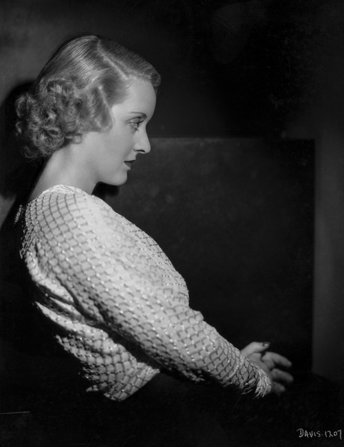 Bette Davis Portrait in Leaning Back with Hands on the Lap in White Lace Long Sleeve Shirt with Marce Wave Hairstyle Photo Print - Item # VARCEL693314