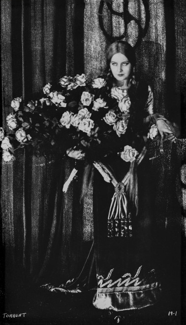 Greta Garbo standing with Bouquet of Flowers Photo Print - Item # VARCEL693350