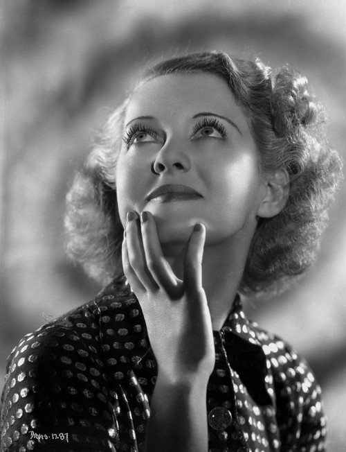 Bette Davis Portrait Hand on the Chin Looking Up in Polka Dot Black Dress with Short Curls Photo Print - Item # VARCEL693398